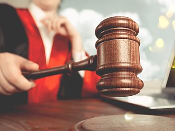 Man holds gavel judge with lawyer