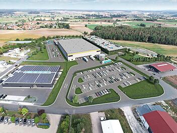 Die Visualisierung des Bauträgers zeigt das geplante Amazon-Gebäude im Gewerbegebiet Limbach. Das Gebäude vorne links mit dem blauen Streifen auf dem Dach existiert bereits. Es gehört nicht zu Amazon, sondern darin ist die Firma Hofmann zuhause. Visualisierung: P3 Logistic Parks