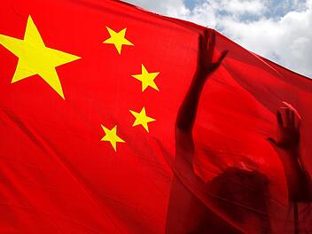 China und Wonsees  haben in  Corona-Zeiten eine Gemeinsamkeit. Symbolbild: Kin Cheung/AP/dpa