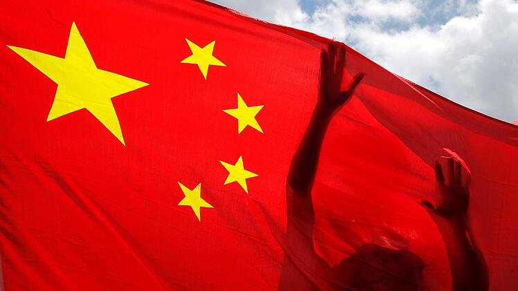China und Wonsees  haben in  Corona-Zeiten eine Gemeinsamkeit. Symbolbild: Kin Cheung/AP/dpa