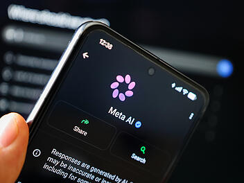 Phone in hand displaying Meta AI on WhatsApp