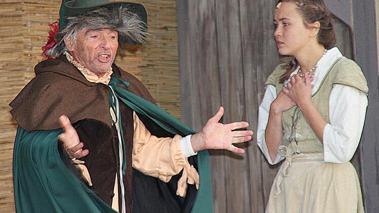 Rumpelstilzchen (Dieter Villhauer) verlangt von der Königin (Elke Thomas) das erste Kind.  Foto: Dieter Britz