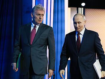 Putin und sein Pressesprecher Peskow