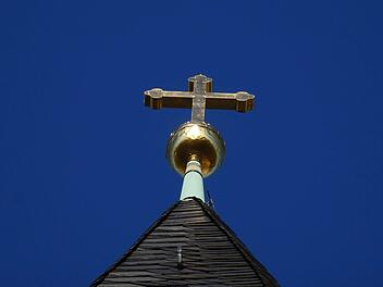 Kreuz auf St. Augustin. In dieser Kirche beginnt am Sonntag die ökumenische Friedensdekade mit einem Gebet.Jochen Berger