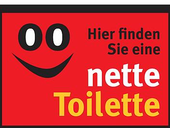 Dieses Schild weist auf die "netten Toiletten" hin.