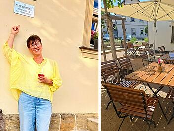 Eine Person in gelber Bluse steht l&auml;chelnd vor einem Geb&auml;ude. Daneben ein einladender Au&szlig;enbereich eines Caf&eacute;s mit Holztischen und Sonnenschirm.
