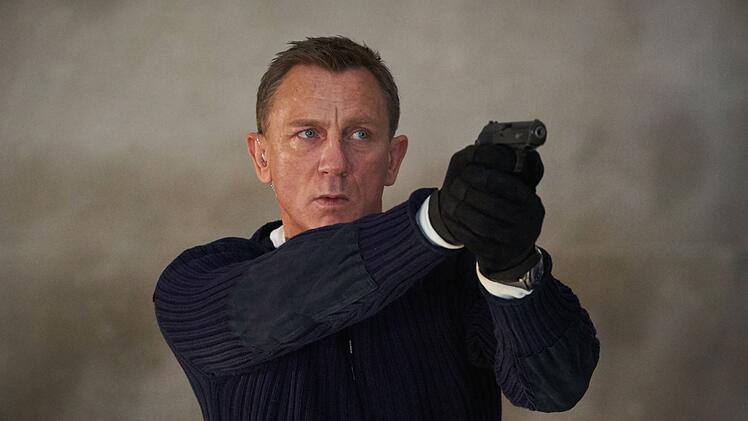 So kennt man James Bond, hier in "James Bond 007: Keine Zeit zu sterben" dargestellt von Daniel Craig: als taffen, entschlossenen Agenten, der mit einer Waffe ausgestattet ist.