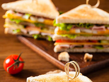 Delicious toast sandwich with ham, cheese, egg and vegetables.