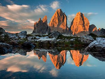 Drei Zinnen or Tre Cime di Lavaredo with reflection in lake at sundown, Dolomites, South Tirol, Italian Alps, Europe  Drei Zinnen mit Spiegelung im See bei Sonnenuntergang, Dolomiten Alpen