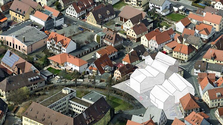 Das Modell f&uuml;r B&uuml;rgerzentrum und Bibliothek ist in ein Luftbild montiert worden.  Montage: Auer & Weber