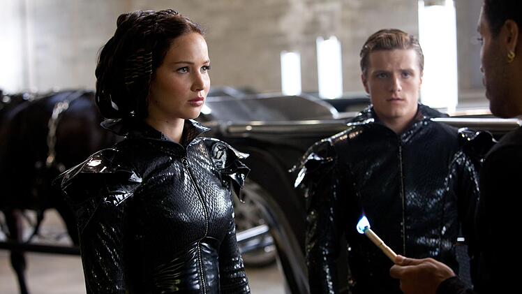 Sie nehmen in ersten Teil der Filmreihe f&uuml;r Distrikt 12 an den "Hungerspielen" teil: Katniss (Jennifer Lawrence) und der B&auml;ckerssohn Peeta Mellark (Josh Hutcherson) k&auml;mpfen dort gegen 22 andere Teenager - und gegeneinander.