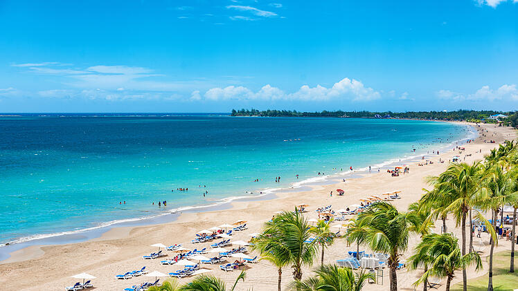 Puerto Rico beach travel vacation landscape background. Isla Verde resort in San Juan, famous tourist cruise ship destination in the Caribbean.