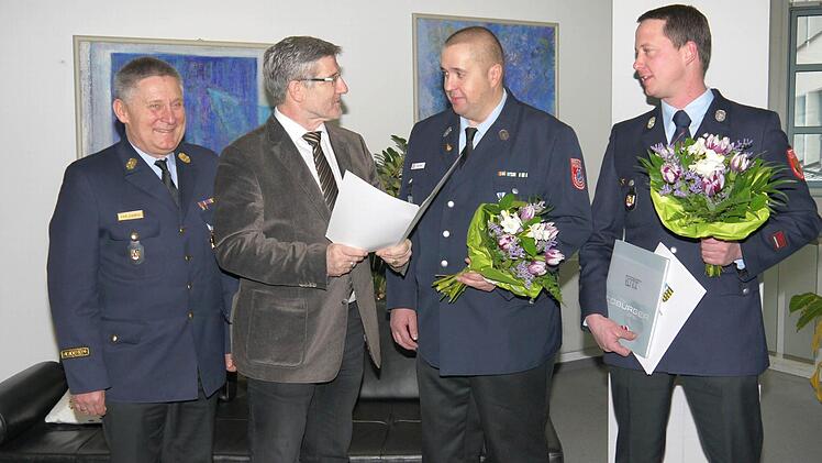 Der offizielle Akt im Landratsamt (von links): Manfred Lorenz, Michael Busch, Oliver Rupp und Stefan Wunder.