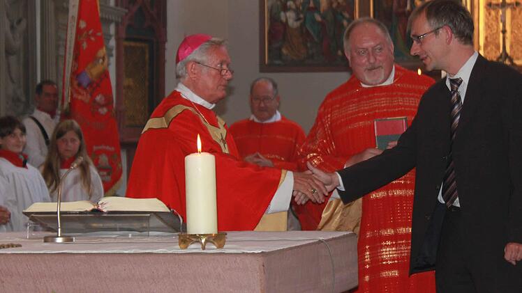 "Willkommen zurück aus dem Ausland München", begrüßte der Bischof den Kirchenmusiker Wolfgang Schneider.