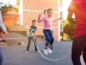 Children playing with skipping rope
