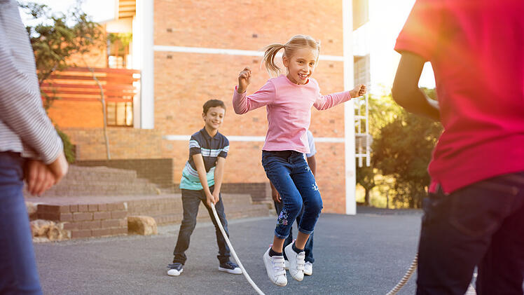 Children playing with skipping rope