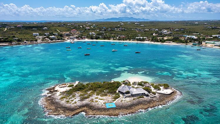 Aerial view of Island Harbour with Scilly Cay in the foreground and Saint Martin in the distance