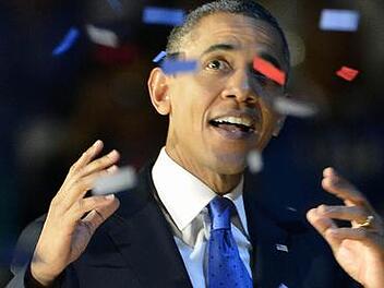 Barack Obama im Konfettiregen nach seinem Wahlsieg Foto: dpa