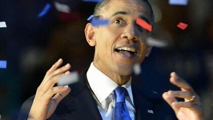 Barack Obama im Konfettiregen nach seinem Wahlsieg Foto: dpa