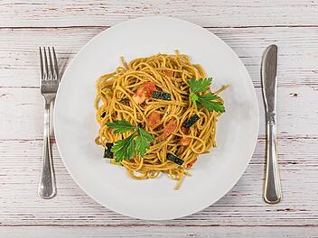 Ein Teller Spaghetti im Restaurant: Mehr als nur die Zutaten bestimmen den Preis.