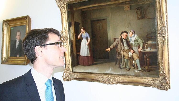 Florian Hawranek vor einem Bild, das Firmengründer Carl Kreul (1803- 1867) gemalt hat.