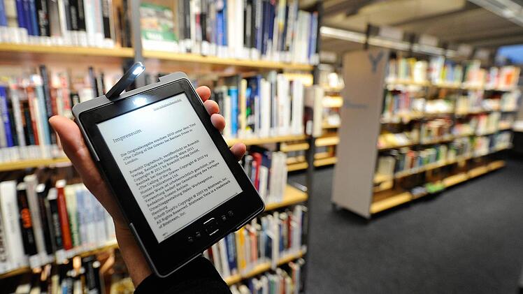 Das Lesen und kaufen digitaler Bücher sollte genauso einfach sein wie das von herkömmlichen Büchern. Foto: Axel Heimken,dpa