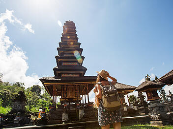 Woman tourist in a temple on the island of Bali