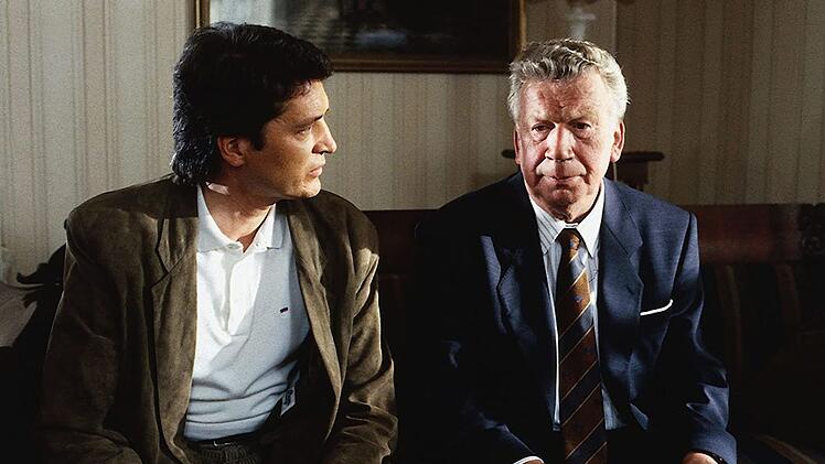 Heinz Reincke spielte im "Landarzt" &uuml;ber 20 Jahre und bis kurz vor seinem Tod den Pastor und B&uuml;rgermeister Albert Eckholm (Bild, rechts). Er starb 2011 an Lungenkrebs.