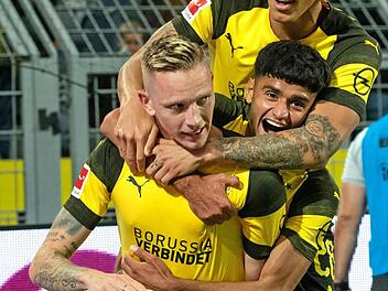 Am 3. Spieltag traf Marius Wolf im Signal Iduna Park gegen seinen Ex-Klub Eintracht Frankfurt. Er jubelt mit Mahmoud Dahoud und Axel Witsel (oben) über sein Tor zum 2:1.  Foto: Bernd Thissen/dpa
