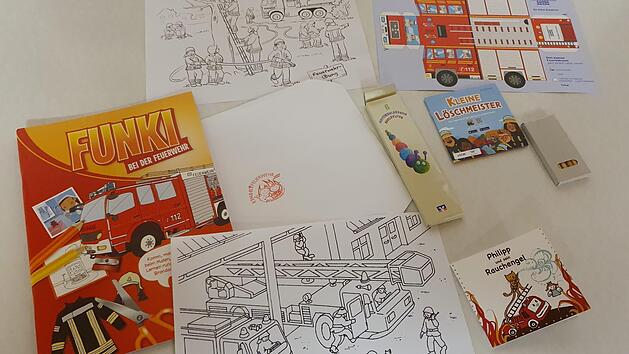 Ausgestattet mit Ausmalbildern und -b&uuml;chern, Bastelbogen und -heft sowie einem Online-Spiel und einem Bilderbuch soll das Geschenkp&auml;ckchen den j&uuml;ngsten Feuerwehrangeh&ouml;rigen zeigen: "Wir sind noch da und denken an euch!"privat