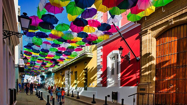 Shoppers stroll through historic Old San Juan. It is the oldest settlement within Puerto Rico and the historic colonial section of the city of San Juan.