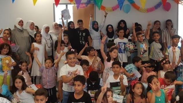 Mitglieder der muslimischen Gemeinde im Heroldhaus bei einer Schulabschlussfeier p.