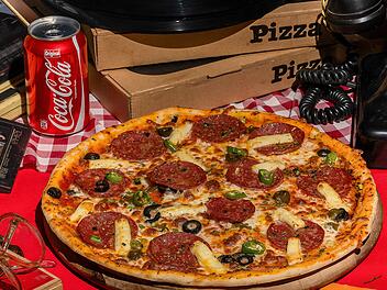 Pizza, Cola & Co: Jeder Konsum kostet gesunde Lebenszeit