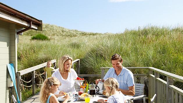 Family on vacation eating outdoors