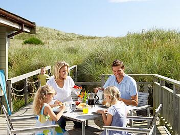 Family on vacation eating outdoors