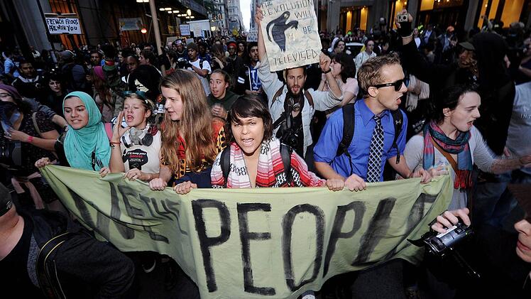 Occupy-Demonstranten in der New Yorker Wall Street im Herbst 2011.   Foto: dpa
