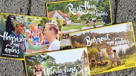 Postkarten werben an Unis.