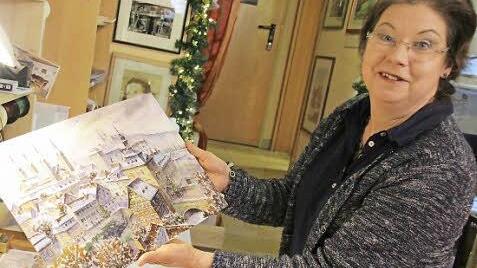 Elfi Roßteutscher beglitzert die Kalender von Hand. Foto: Simone Bastian