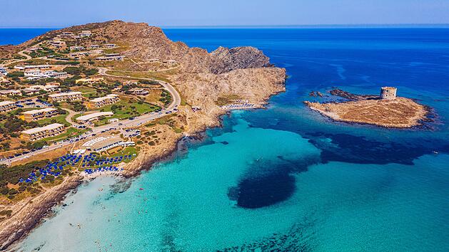 Stunning aerial view of Pelosa Beach (Spiaggia Della Pelosa) with Torre della Pelosa and Capo Falcone. Stintino, Sardinia, Italy. La Pelosa beach, probably the most beautiful beach in Sardinia, Italy