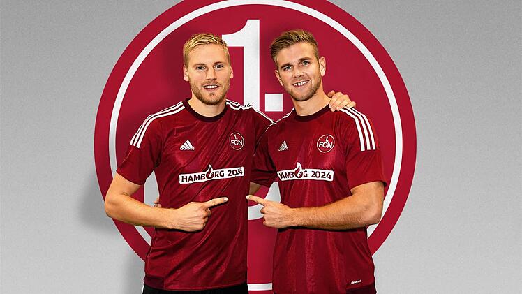 Hanno Behrens und Niclas Füllkrug mit dem Olympia-Flock auf dem Trikot. Foto: Jens Ballon/1. FC Nürnberg