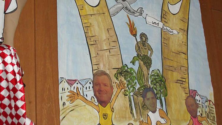 Erich Wolfert schuf das Plakat mit dem Motto für die Session: Die drei Bürgermeister als Sprintsieger, Barbara Baumbach auf dem Abflug.