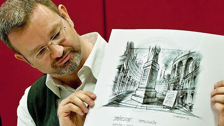 Michael Heinrich mit dem Entwurf für den Portalschleier zu "Dorian Gray". Die Musical-Oper von Roland Fister wird am 8. Juni in Coburg uraufgeführt. Foto: Jochen Berger