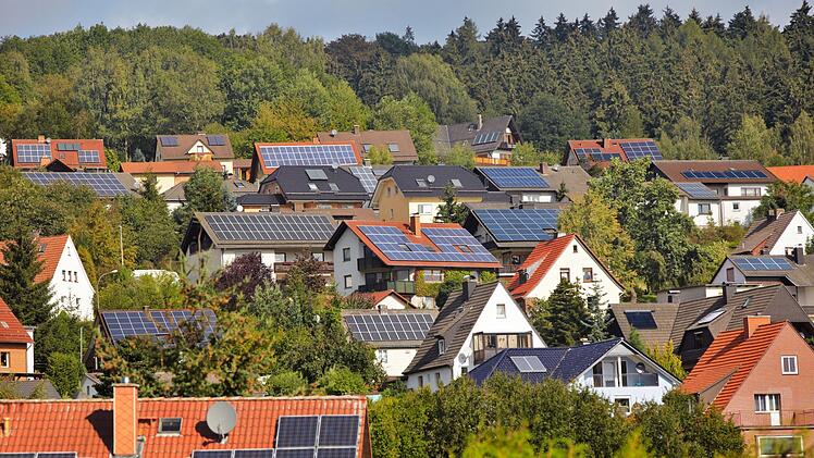 view on houses with solar thermal and photovoltaik roof systems