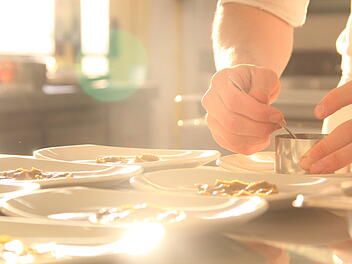 chef serving a delicious healthy dish in a restaurant