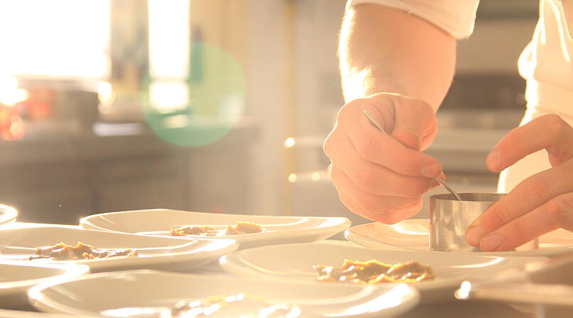 chef serving a delicious healthy dish in a restaurant