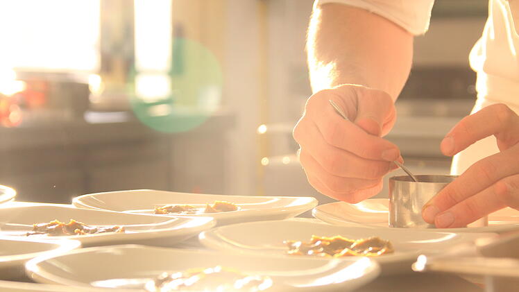 chef serving a delicious healthy dish in a restaurant