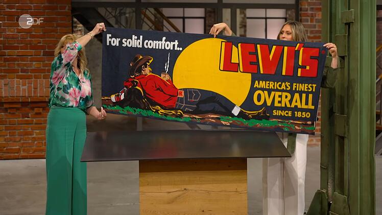 "Das ist ja cool", schwärmte Sarah Schreiber vom wohl "stylischsten Cowboy seit langem". Elke Velten und sie hielten für die Kollegen das Plakat hoch. "Overall?", las Benjamin Leo Leo vor und fragte sich: "Was heißt das?" Eine Jeans ist doch kein Overall ...