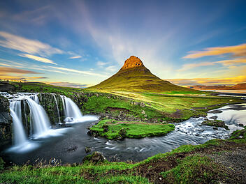 Sunset over Kirkjufellsfoss Waterfall and Kirkjufell mountain in
