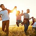 Happy family: mother, father, children son and daughter on sunset