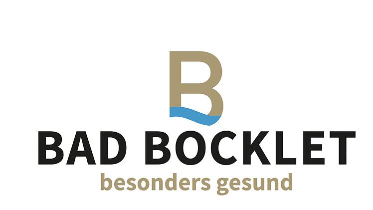 Das neue Logo des Staatsbades mit goldenem B auf blauem Fluss. Grafik:  Hd7B Medien